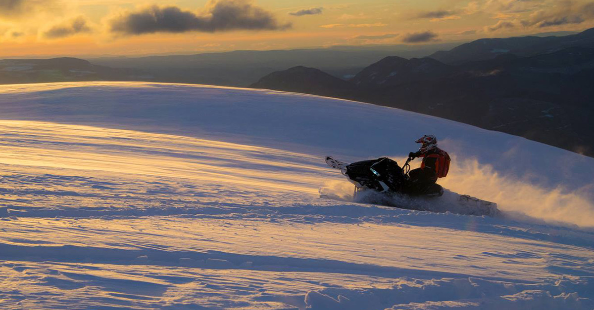 Riding the snow at Crooked Lake at sunset