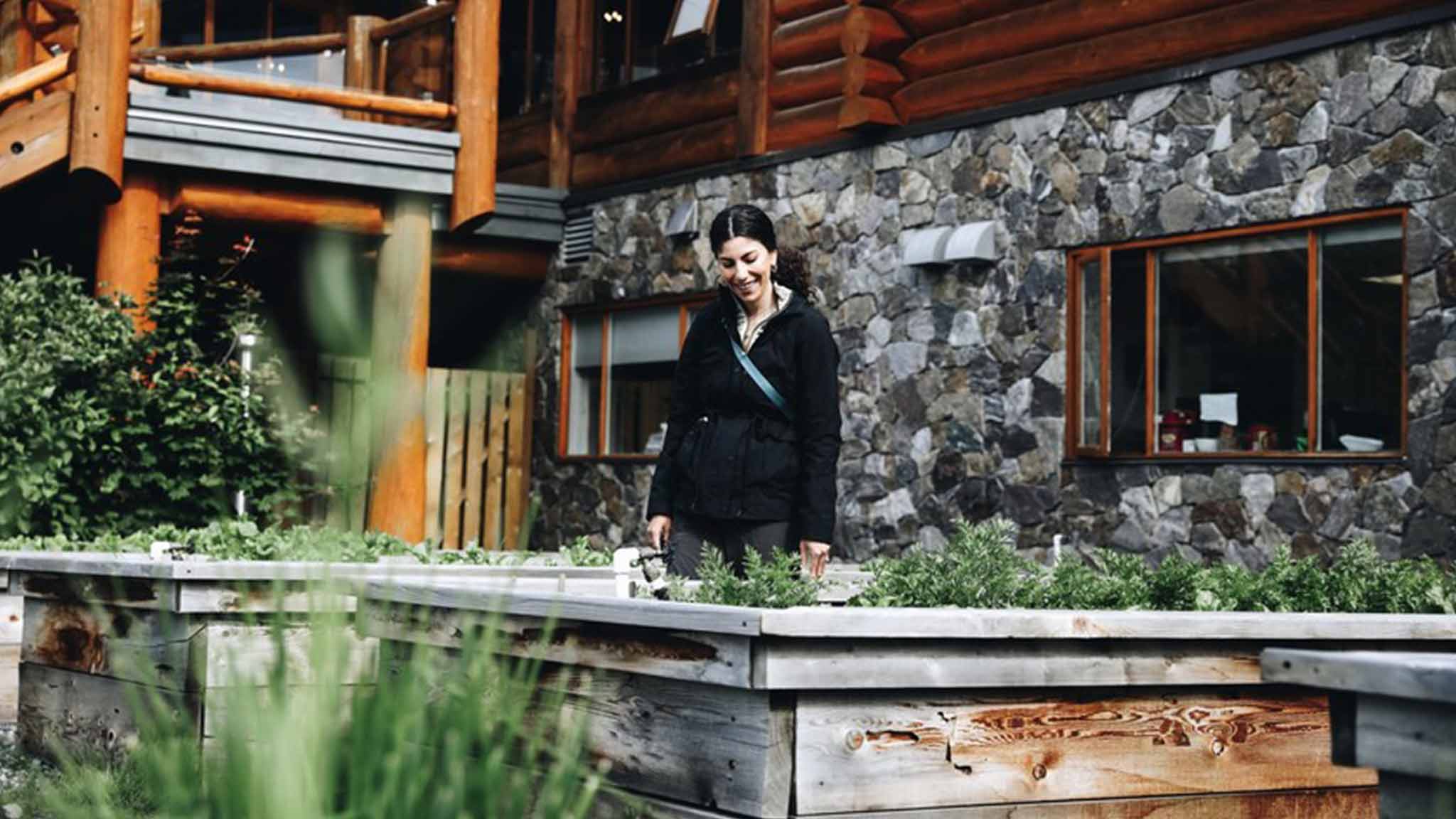 Woman looking at a small local garden