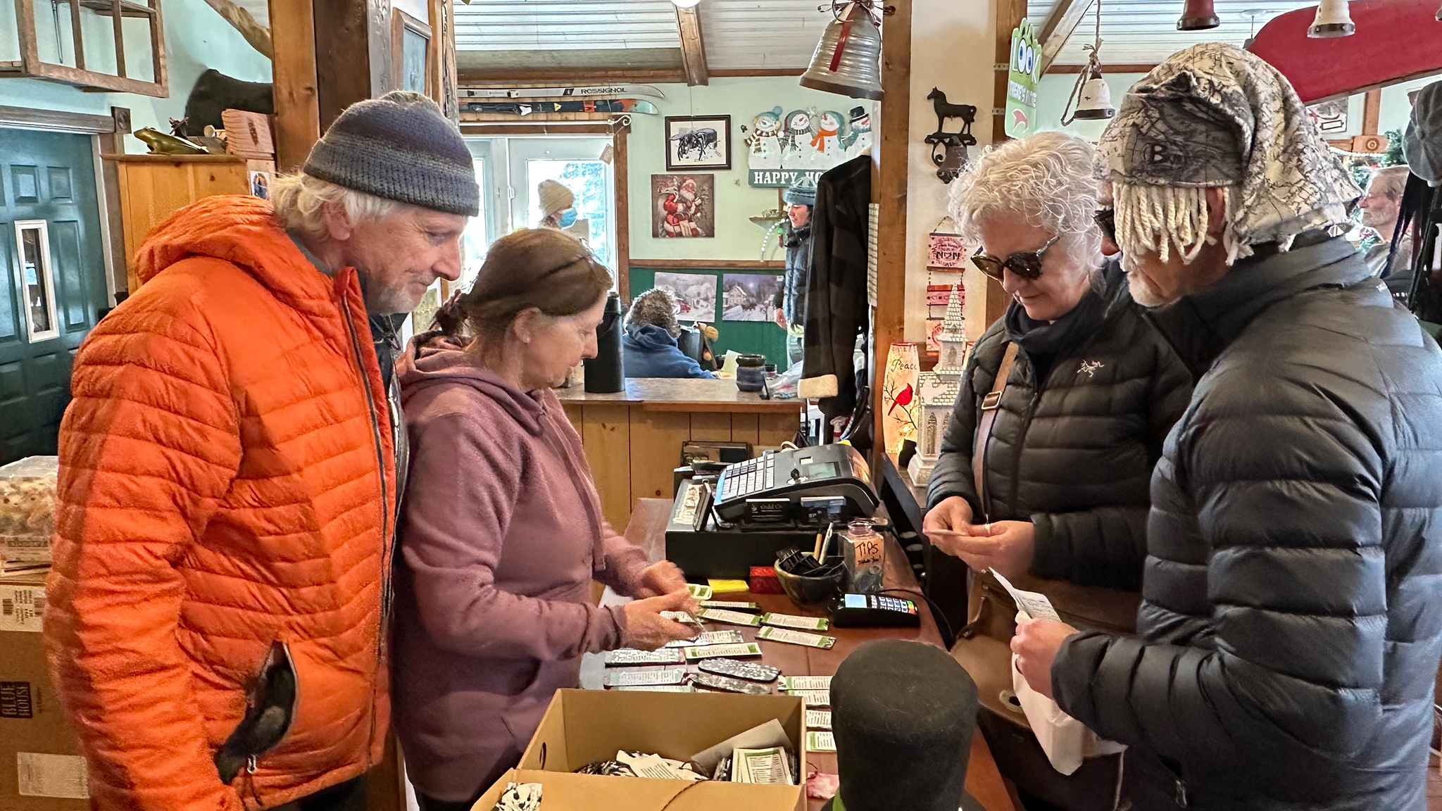 Skiers collect their registration package at The Frog on the Bog